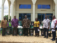 Avedzi (in black-yellow smock) with some officials of the constituency