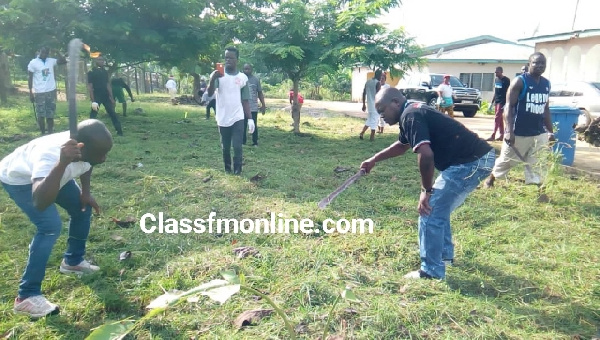 Some members of the NDC taking part in the weeding exercise