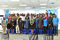 Standard Chartered executives in a photo with the students