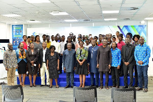 Standard Chartered executives in a photo with the students