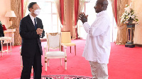 President Museveni (right) engages Mr Yang Jiechi, after a meeting at State House, PHOTO/PPU