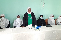 Hajia Anisa Iddrisu Sahiba (standing) with other Executives seated