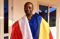 GFA president draped in flags of the two clubs