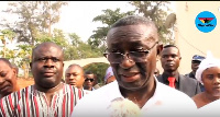 Andy Appiah-Kubi, Asante Akim North MP in glasses speaking to the media