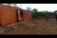 Container set ablaze by irate youth