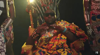 Davido dressed in a Ghanaian kente cloth during a video shoot with Darkovibes