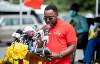 Tetteh Ayitevie, Chief Strategy Officer of Prudential Life Insurance, reading Didier Drogba's speech