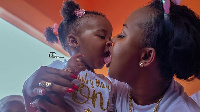 Nana Ama McBrown kisses baby Maxin