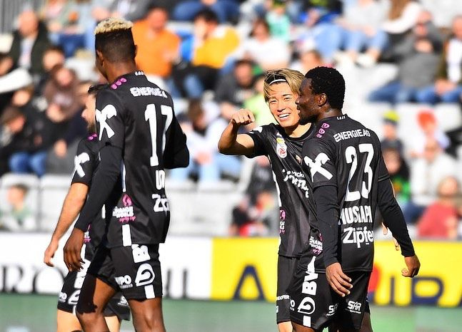 Ibrahim Mustapha (right) congratulated by teammates