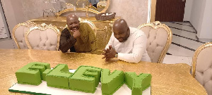 Senyo Hosi admiring the E-Levy cake