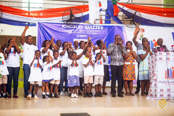 Dr. Kingsley Agyemang with some of the basic school children