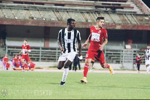 Ghana international Daniel Lomotey [in black and white jersey]