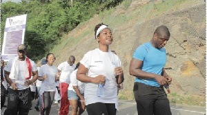 Lexis Bill leads Unilever staff up the Aburi Hills