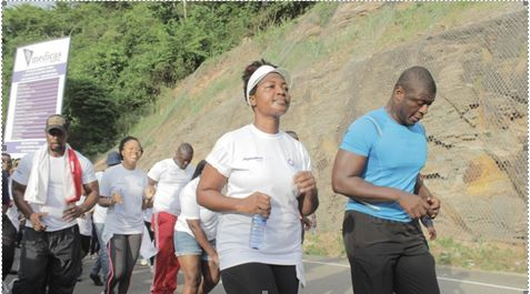 Lexis Bill leads Unilever staff up the Aburi Hills