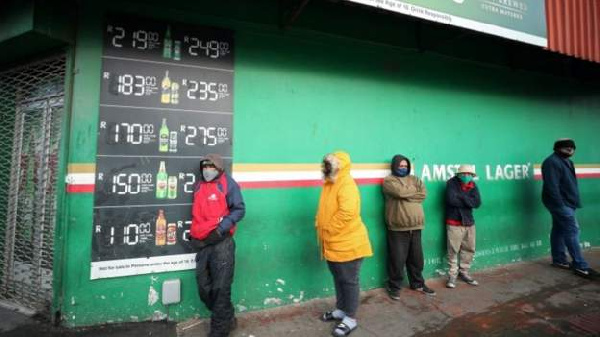 Queues have been witnessed outside liquor stores in major cities.