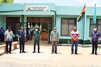 Mr Apau (second right) and Monsieur Assan (third right) with some security agency representatives