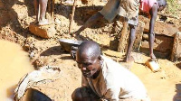 Workers at a gold mining site. PHOTO | FILE