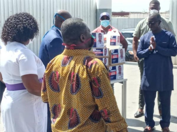 Prince Appiah Debrah with some officials of the hospital