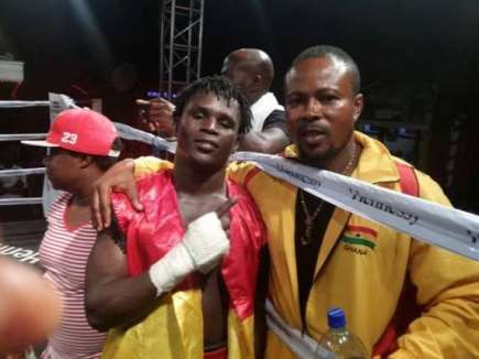 Patrick Ayi with cornerman