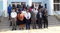 A group photograph of officers and participants at the opening ceremony