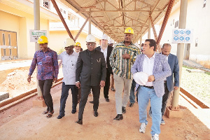 Defence Minister, contractors and officials inspecting the project at Afari