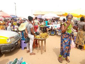 A cross section of people at the Anloga Market