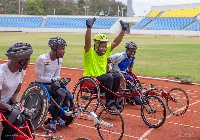 Sampson Deen with the three athletes after the race