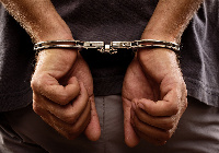 File photo of a man in handcuffs