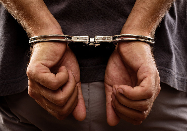 File photo of a man in handcuffs