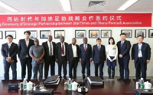 Officials at the signing of the agreement