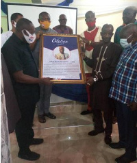 General Secretary, John Boadu presenting an award in the form of citation to Alhaji Mohammed Adam