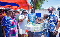 Obuobia Opoku-Darko presents the items to the orphanage home