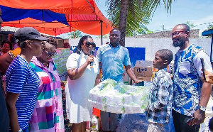 Obuobia Opoku-Darko presents the items to the orphanage home