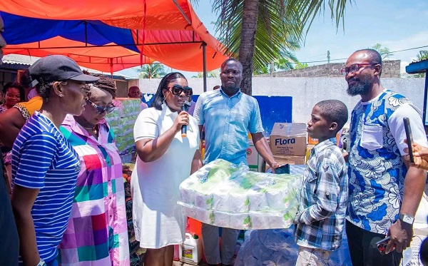 Obuobia Opoku-Darko presents the items to the orphanage home