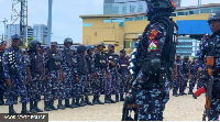 Di police carry long convoy wit armed officers dey patrol som part of di state