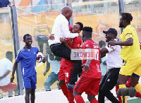 Asante Kotoko coach, Dr. Prosper Narteh Ogum and youngster Isaac Oppong