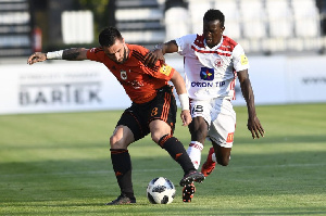 Osman Bukari in white and red jersey