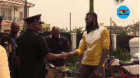 ACP Kwesi Fori sharing a handshake with Emmanuel Adebayor