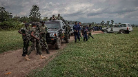 Units of the Armed Force of the Democratic Republic of Congo and police stand at Kiwanja airfield