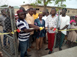 Saeed Muhazu Jibril presenting the boreholes to the Busunu community