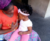 24-year-old mother, Adams Warahama with her daughter