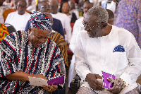 John Mahama and John Kufuor share a moment of laughter at the ceremony