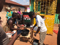 Some of the residents making use of the Veronica bucket