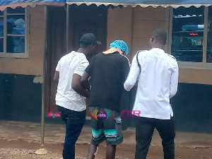 Lil Win being taken to the police station