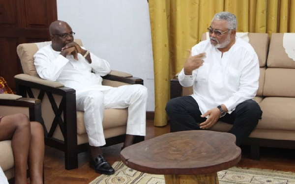 Former mayor of Kumasi, Kojo Bonsu [L] paid a courtesy call on Former President Rawlings [R]