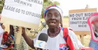 One of the furious women holding the placards