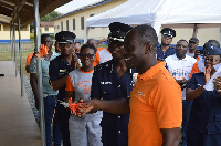 Delvyn Sandison with some police personnel during the commissioning