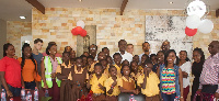 Employees of Barclays, children and officials of Street Academy in a group picture