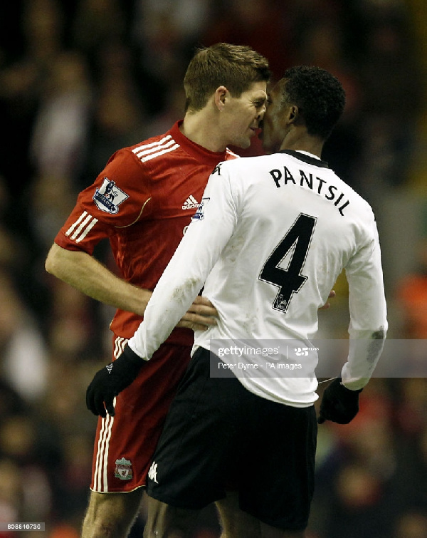 Steven Gerrard and John Paintsil during a Premier League game