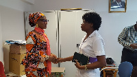 Hon Iddrisu Mariam, MCE for Sagnarigu in a handshake with a staff at TTH